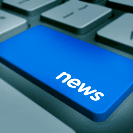 Computer keyboard displaying news key