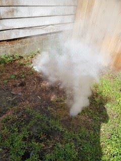 Smoke flows from a defective or improper connection at a sewer cleanout